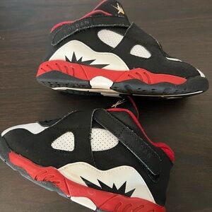 Jordan Black and Red Sneakers with Cross-Straps